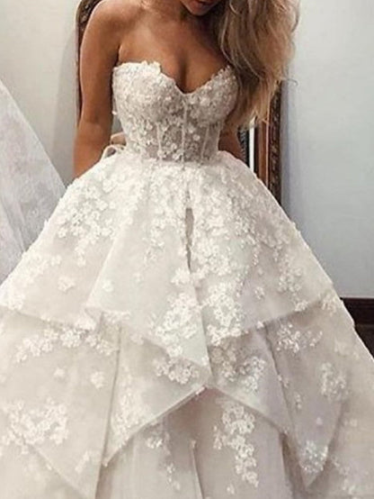Vestidos de novia largos de tul con encaje y cola de cepillo, sin tirantes y corte A