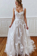 Robe de mariée longue en ligne A avec bretelles, décolleté en cœur, appliques en dentelle, tulle et dos nu