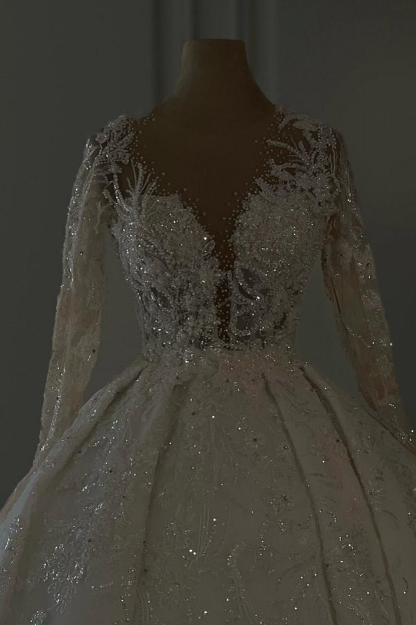 Abito da sposa lungo color avorio lussuoso a linea ad A con scollo a V, pizzo e maniche lunghe con scintillio