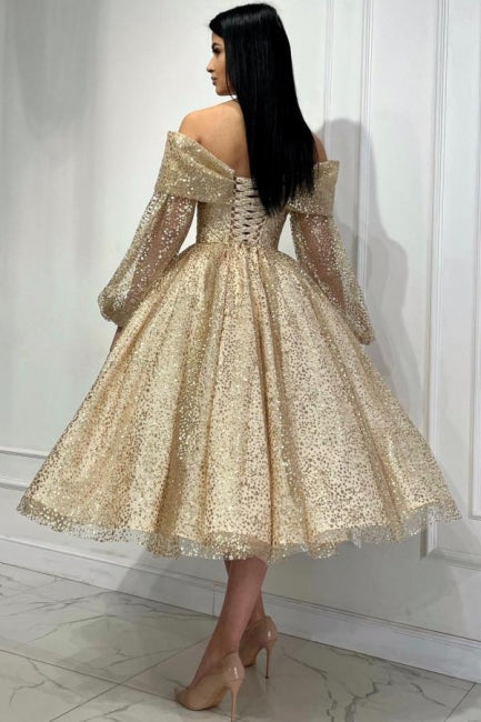 Abito da sera ossessionante oro a linea ad A con scollo a spalle scoperte e paillettes, maniche lunghe