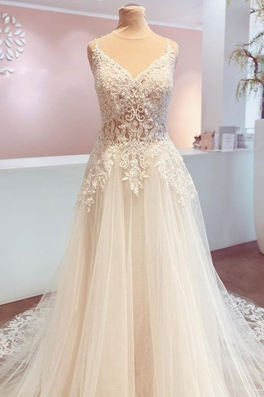 Vestido de novia romántico largo de corte A con tirantes finos, apliques de encaje y espalda descubierta