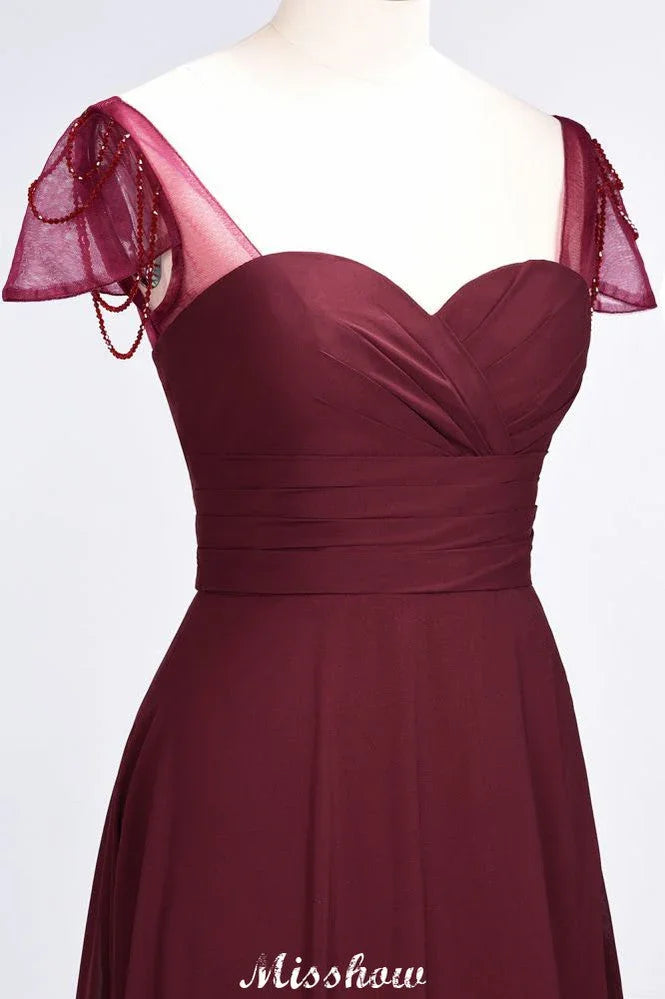 Vestido de dama de honor con volantes, manga corta tipo capa, largo hasta el suelo y abalorios Moher si la novia viste