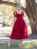 Robe de bal en dentelle longueur thé avec bretelles en forme de nœud et corset