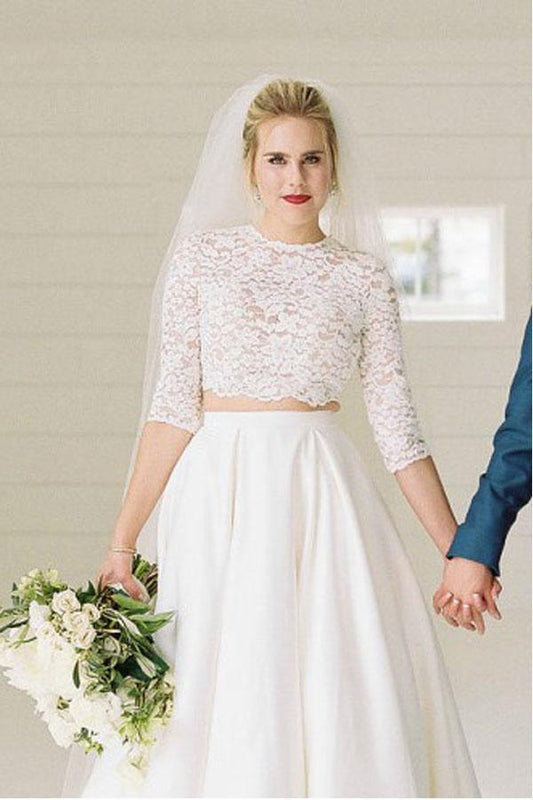 Zweiteiliges, durchsichtiges Brautkleid mit halblangen Ärmeln und Spitzenoberteil