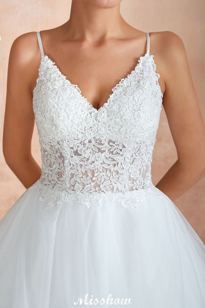 Vestido de novia blanco con cola de capilla, tirantes finos, transparente y con cordones, a la venta.